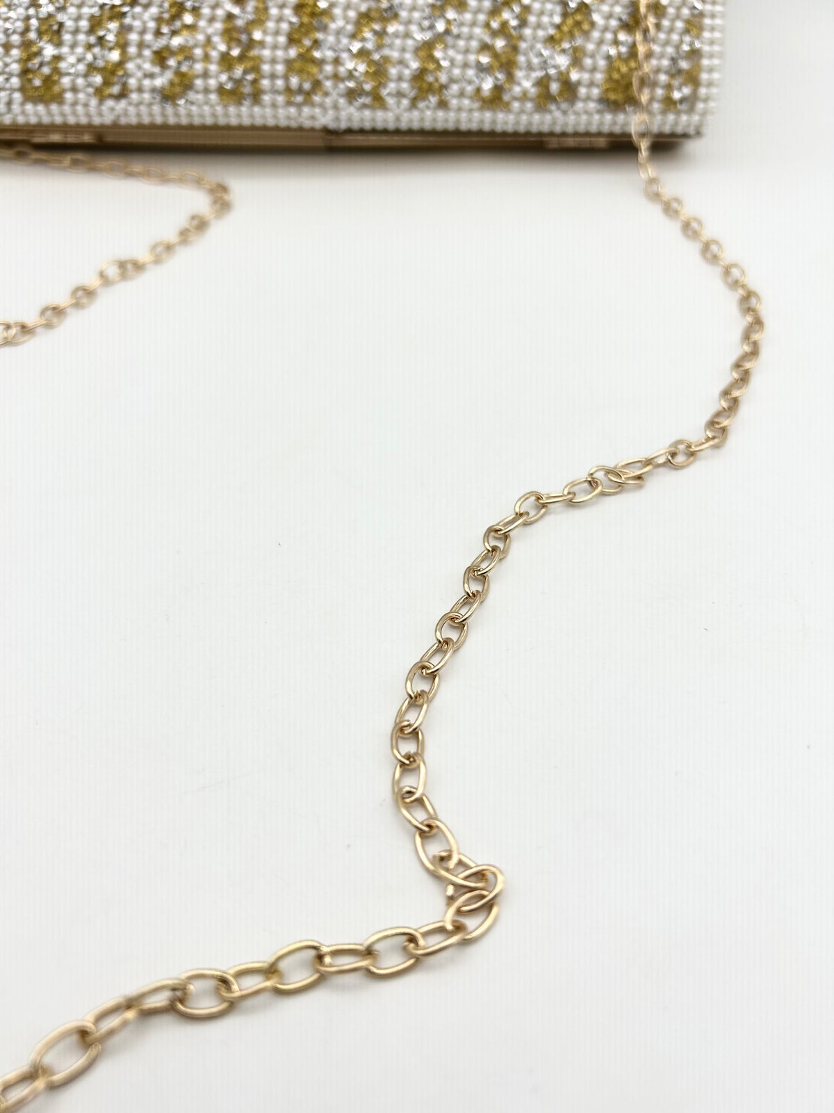 AM700 Gold and White clutch bag