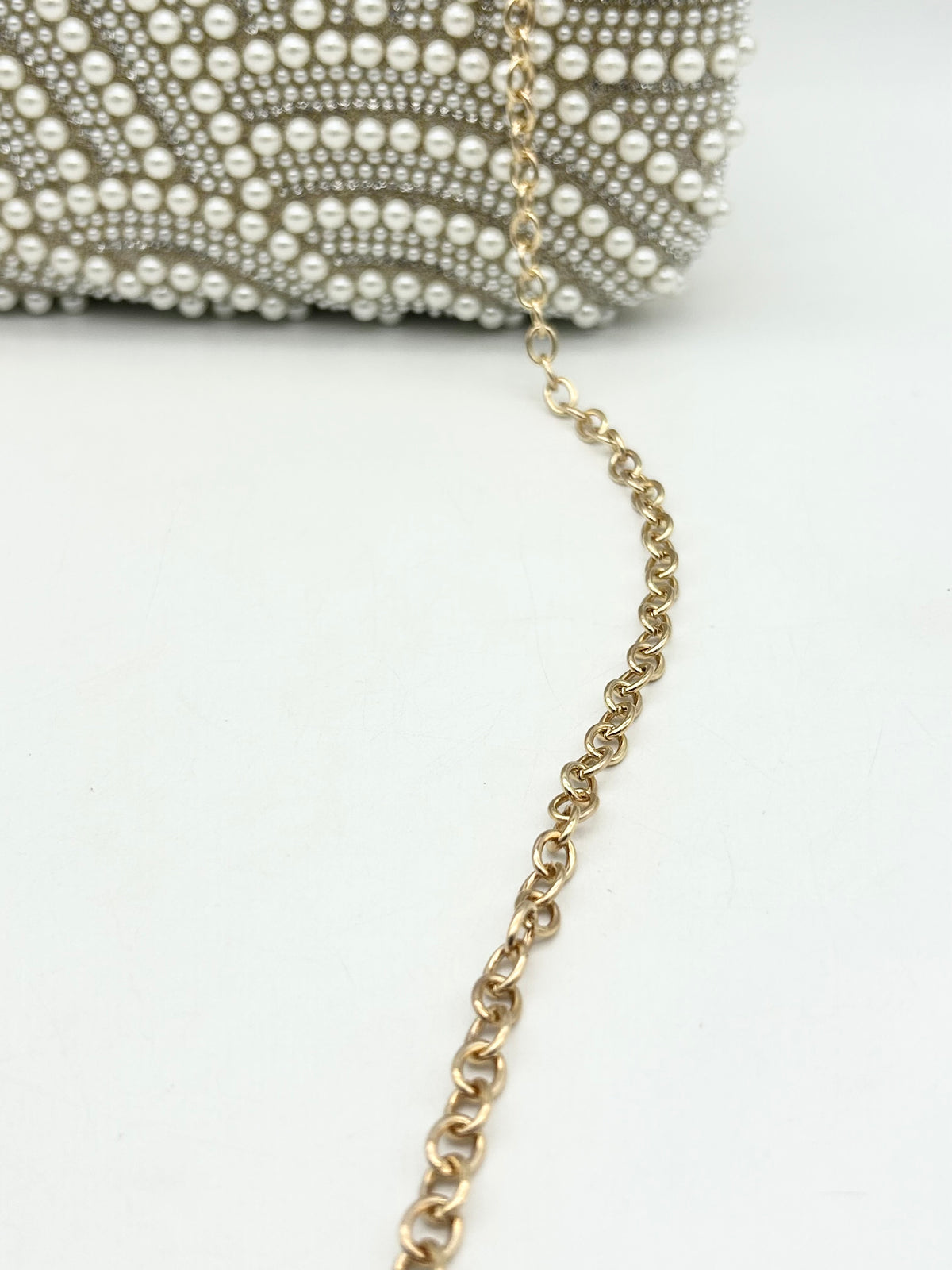 AM703 Gold clutch bag